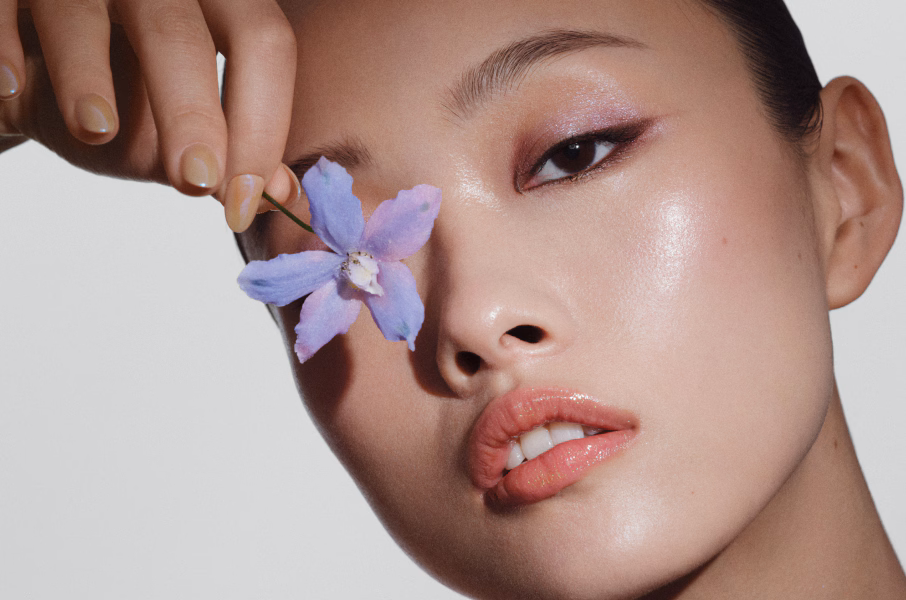 Closeup of model applying our iconic Velvet Teddy Matte Lipstick